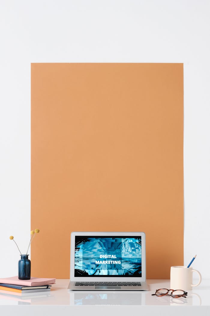 Modern workspace featuring a laptop with a digital marketing screen, ideal for business and technology themes.